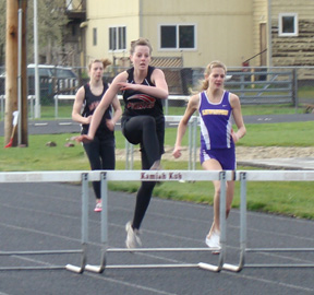 NaTosha Schaeffer clears one of the final hurdles in the 300 hurdles race.