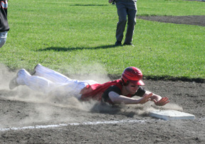 Conner Rieman slides headfirst into third with a 1st inning triple against Kendrick.