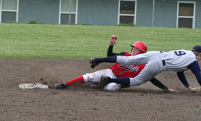 Silas Whitley slides safely into second as the Genesee shortstop has to dive after the ball.