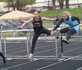 NaTosha Schaeffer clears a hurdle.