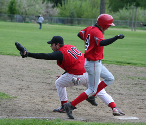 Joe Schumacher catches a throw to nip a C.V. runner at first.