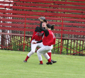 Justin Schmidt and Silas Whitley nearly collide as Schmidt makes a catch at C.V.