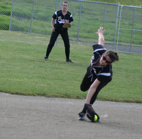 Amber Holthaus snags a low line drive at second base to end the first inning against Lewis County. In the background is Alena Hoene.
