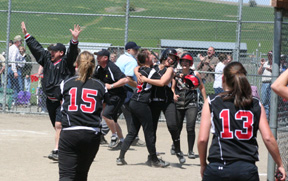 The Lady Pirates celebrate after their bottom of the 7th comeback to win the District title.