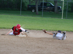 David Sigler slid around the tag as he makes his way safely to second base in the first Genesee game.