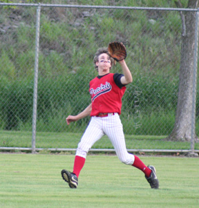Justin Schmidt lost his hat but is about to make a catch in centerfield in the first Genesee game.
