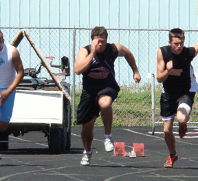 Kyler Shumway, who uses a 3-point football lineman stance to start instead of blocks, in the 100 meter dash.