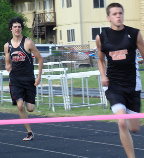 Ryan Dalgliesh in the 400 meter dash final where he finished third and qualified for state. He also qualified in the high jump.