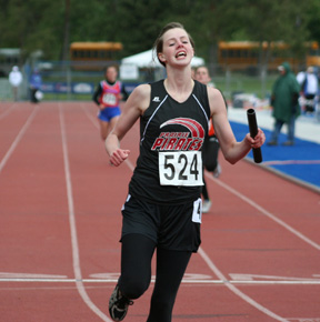 MaKayla Schaeffer crosses the finish line in first place in the 4x200.