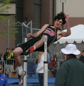 Ryan Dalgliesh brushes into the bar as he attempts to clear opening height in the high jump.
