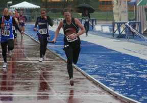 You can see the snow and slush on the field as NaTosha Schaeffer finishes the 4x400 relay in second place.