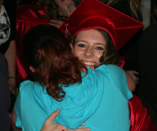 Amber Frei gets a hug after graduation.