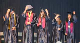 Summit students flip their tassels after receiving their diplomas.