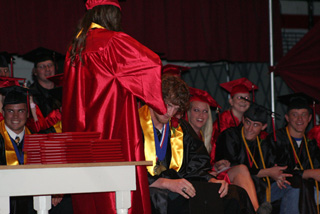 NaTosha Schaeffer surprised the whole class, including David Sigler, by clipping off a lock of David's curls. If you've seen him since, he has had the rest of them shaved off. Click for a larger view.