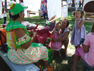 A clown is part of the carnival attractions for youngsters at the Raspberry Festival.