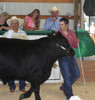 Tate Stowers with his reserve champion for quality steer.