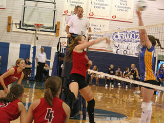 MeShel Rad gets a spike past a Nezperce blocker. Watching are Tanna Schlader, Monica Lustig and Megan Sigler.
