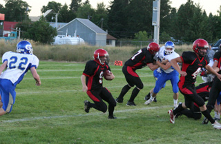 Brock Heath follows Devin Schmidt through a huge hole for big yardage. Blocking behind Heath is David Johnson.