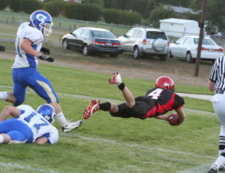 Shown is the end of the play above as Devin Schmidt dives into the end zone for his first of 4 touchdowns.