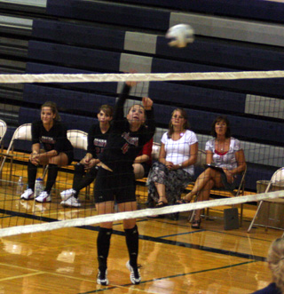 Megan Sigler spikes the ball.