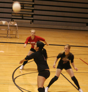 Fran Johnson makes a pass in the Highland match as Demetria Riener and Tanna Schlader watch.