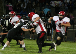Josh Roeper seals off a Deary defender to give Devin Schmidt some running room.
