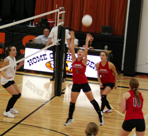 Megan Sigler sets the ball against Asotin at the Kendrick Tournament. Also shown are Shelby Duman and Kayla Johnson.