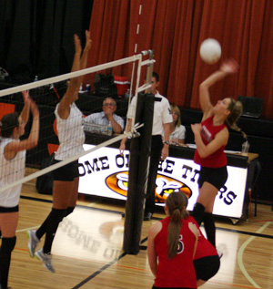 Shelby Duman spikes the ball against Asotin at the Kendrick Tournament.