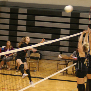 Tanna Schlader spikes the ball at Highland.
