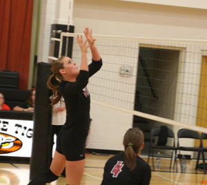 MeShel Rad gets ready to tip the ball over at Kendrick. #4 is Megan Sigler.