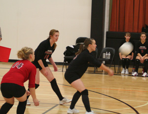 Monica Lustig makes a pass at Kendrick as Demetria Riener and Kayla Johnson watch.