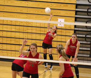 Megan Sigler serves as Kayla Johnson, 10, signals for the defense. Also shown are Sam Poxleitner, Shelby Duman and MeShel Rad.