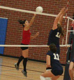Fran Johnson tips the ball over the net against Grangeville at the Genesee Tournament.