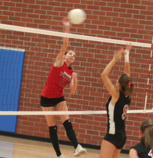 Sam Poxleitner spikes the ball against Deary at the Genesee Tournament.