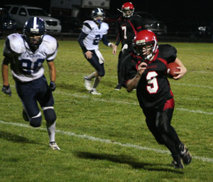 Brock Heath got outside on a sweep to the left. In the background is Beau Schlader.