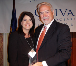 Casey Meza, CEO, St. Marys and Clearwater Valley Hospitals is pictured with Steve Millard, President, Idaho Hospital Association, after receiving an award for Excellence In Patient Care.