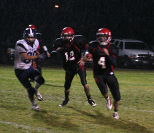 Devin Schmidt runs the ball early in the second half. To his right is Tim Frei.