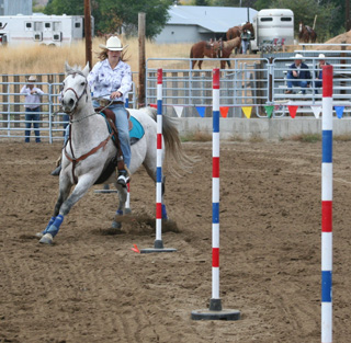 Kelsey Tidwell in the pole bending.