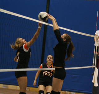 MeShel Rad rejects a Troy attempt to put the ball over the net.