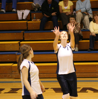 Jamie Chmelik sets the ball as Rachel Wemhoff watches as Summit played Nezperce at District.
