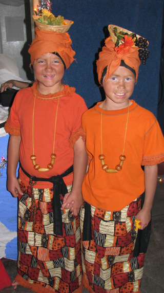 Taylor Lustig and Theresa Wemhoff dress the part of African saint, Josephine Bakhita at the Holyween party last Friday.