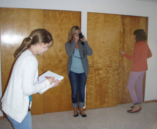 Students from the U of I Interior Design program are partnering with SMHC to propose design concepts for the house recently purchased by the hospital.  Pictured are Amanda Grabon, Meghan Page and Kim Hoppe measuring, photographing and taking notes in one of the bedrooms.