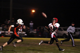 Justin Schmidt caught this pass in full stride and turned up field for an 88 yard scoring play.