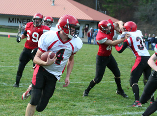 Devin Schmidt had some open field to work with on this run. Cody Schumacher can be seen blocking.