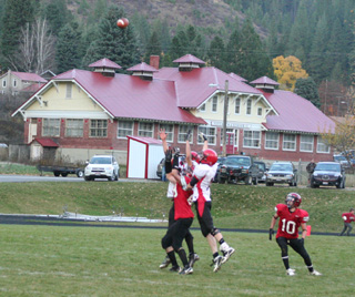 Devin Schmidt and Justin Schmidt go up with a Wallace receiver on a long fourth down pass. Justin Schmidt came down with an interception on the playl