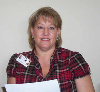 Shown is Stacie Jackson going over the guidelines for the Angel Tree Project