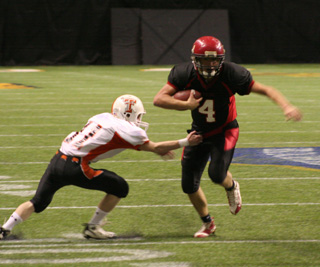 Devin Schmidt cuts to the inside to evade a tackler.