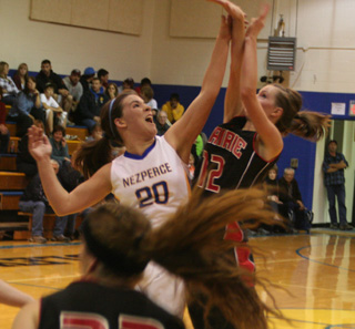 MaKayla Schaeffer gets a shot away over a block attempt.