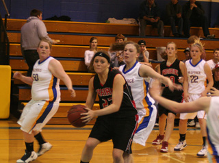 MeShel Rad makes a move on offense. In the background is Tanna Schlader.