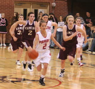 Callie Mader heads for the Prairie basket after a steal. MeShel Rad and Megan Sigler trail on the play.